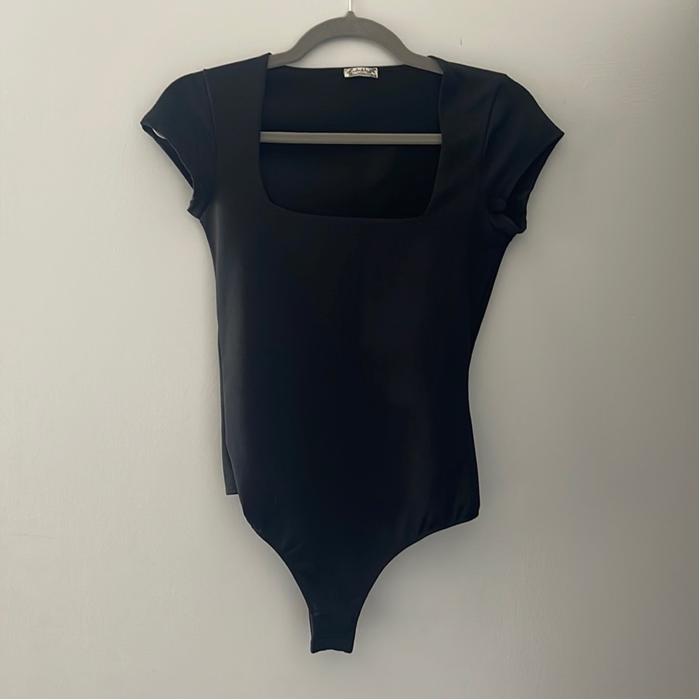 Free People black short sleeve bodysuit